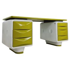 a green and white desk with two drawers on each side, one drawer open to the other