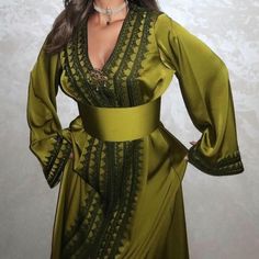 Refined and luxurious caftan in silk satin, worked with dfira and Aakad (handmade artisanal buttons) and decorated with pretty Moroccan embroidery in dark green silk thread. Belt is included. You can wear it during wedding ceremonies, but also for all occasions such as engagement, henna parties (by the bride or the guest), birth, baptism party, baby shower, Taarouf day . Made to order. Can be made in XS, S, M, L, XL, XXL and XXXL (Please see our size guide in the images). Caftan length 1m60cm PRODUCTION TIME: 2-3 weeks. DELIVERY TIME: 2-5 days via FedEX 📸 PICTURES Listing photos are taken in natural light. Depending on your screen definition, colors may vary. ❌All photos of our products are real photos❌ Interview Hand wash in cold water or dry clean. Moroccan Dress Modern, Dress Nikah, Moroccan Outfit, Moroccan Embroidery, Moroccan Takchita, Morrocan Fashion, Moroccan Kaftan Dress, Dress Islamic, Silk Caftan