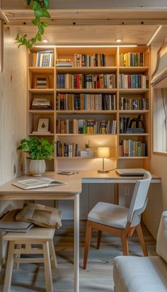 a home office with bookshelves, desk and chairs