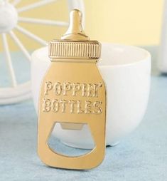 a bottle opener with the words poppin'bottles on it