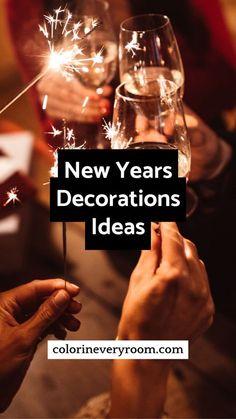 people toasting with wine glasses and sparklers in the background text reads, new years decorations ideas