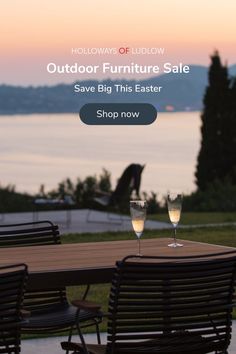 an outdoor furniture sale with two wine glasses on the table and one glass is empty