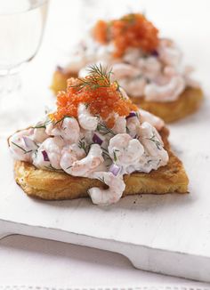 two pieces of bread topped with crab salad