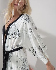 Sometimes, a little drama can be a good thing. This Cool Nights robe is a beautiful example of that, featuring a dramatic sleeve design that gives it a unique silhouette. In our cool-to-the-touch fabric, it's a perfectly comfortable choice for lounging in style. Comfortable style with Soma Intimates. Details 3/4-length sleeves. Attached belt. Approximately 38" from shoulder. 93% rayon, 7% spandex. Machine wash. Imported. Spring Wrap Robe For Sleep, Spring Wrap Sleep Robe, Summer Long Sleeve Nightgown For Lounging, Summer Long Sleeve Sleep Nightgown, Black Long Sleeve Summer Sleepwear, Spring V-neck Robe For Loungewear, Spring V-neck Sleep Robe, Spring Lounging Wrap Sleepwear, Spring Sleep Robe With Kimono Sleeves