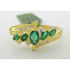 Number Of Diamonds: 12 Shape: Cushion & Round Main Stone Creation: Natural Cut Grade: Very Good Main Stone Color: Green Metal: Yellow Gold Total Carat Weight: 1.10 Carats Secondary Stone: Diamond Main Stone: Emerald Ring Size: 7.75 (Free Resizing Service - If Needed) Setting Style: Prong & Channel Metal Purity: 14k Main Stone Shape: Marquise Base Metal: Gold Number Of Gemstones: 5 Yellow Gold Marquise Emerald Ring, 14k Gold Emerald Ring For Formal Occasions, Green Cluster Jewelry With Diamond Accents, Multi-stone Diamond Emerald Ring, Multi-stone Emerald Ring With Diamonds, 14k Gold Emerald Ring With Diamond Cut, Green Hallmarked Cluster Jewelry, Designing Process, Beautiful Gold Rings