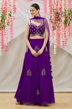 Purple crepe kalidar embroidered lehenga with side tie-up tassels. Comes with embroidered blouse and scallop hem dupatta.
Component: 3
Pattern: Embroidered
Type Of Work: Bead work
Neckline: Sweetheart
Sleeve Type: Sleeveless
Fabric: Blouse and Lehenga:Crepe; Dupatta:Soft Net
Color: Purple
Other Details: 
Side tassel tie-up lehenga
Occasion: Sangeet - Aza Fashions Traditional Sleeveless Lehenga For Eid, Sleeveless Salwar Kameez With Sheer Dupatta For Wedding, Wedding Navratri Palazzo Set In Georgette, Wedding Navratri Georgette Palazzo Set, Sleeveless Georgette Traditional Wear For Wedding, Purple Georgette Palazzo Set For Wedding, Purple Palazzo Set With Resham Embroidery For Wedding, Purple Palazzo Set With Dupatta For Wedding, Purple Wedding Palazzo Set With Dupatta