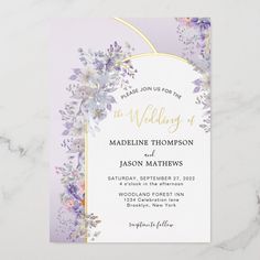 a wedding card with watercolor flowers and gold foil on the front, in lavender tones