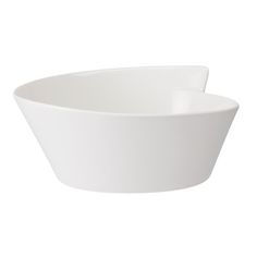 a large white bowl sitting on top of a table