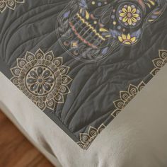 an image of a skull quilt on a bed