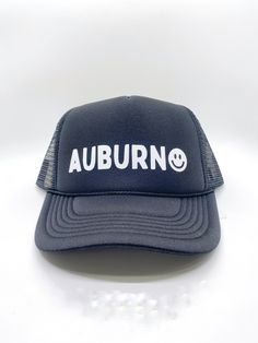 Show your Auburn, Alabama pride with this cute unisex trucker-style hat. The smiley face accent adds the perfect touch to show your love. After all, you are never fully dressed without a smile.  100% Cotton, Adjustable Back Funny Adjustable Trucker Hat For Streetwear, Casual Smiley Face Trucker Hat Snapback, Casual Trucker Hat With Smiley Face, Bride Birthday, Auburn Alabama, Pride Jewellery, Never Fully Dressed, Simple Bracelets, Grad Gifts