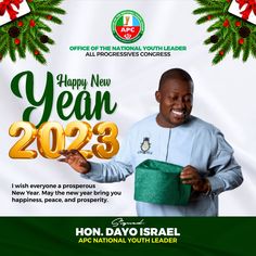 a man holding a green present box in front of a christmas card with the words happy new year 2093