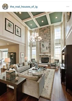 a living room filled with furniture and a fire place in the middle of an open floor plan