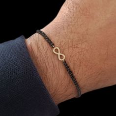 Infinity bracelet. Mens bracelet. 18k gold bracelet for men. The bracelet is made of 18k solid gold and stainless steel chain ( BLACK PVD ). Infinity has always been a romantic symbol, which is why it is also suitable as a couples bracelet. Modern design bracelet loved by men of all ages, a jewel with a strong personality but always refined and elegant. It was born from the need to create a men's bracelet in gold with a competitive price, combining sportiness and precious materials. The bracelet Gold Mens Bracelet, Infinity Bracelet Men, Boyfriend Bracelet, Bracelet Boyfriend, Gold Bracelet Simple, Bracelets For Boyfriend, Mens Chain Bracelet, Bracelet Couple, 18k Gold Bracelet