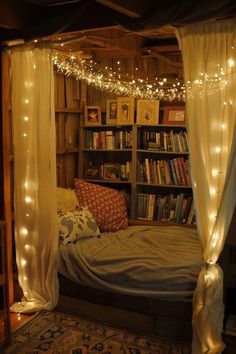 a bed with bookshelves and lights on it