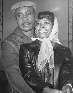 a black and white photo of a man and woman