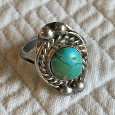 "Vintage Silver Plate and Turquoise Ring. Rope Design Stone Border. Small Ring in Turquoise and Silver. This ring is in pretty good shape. Size:  Top Decoration with Stone: 5/16\" X 3/8\", Size 4 1/4 For other vintage items see: www.VeryVictorianStudio.etsy.com For sewing related items see my other shop: www.SewingRoomStore.etsy.com Thank you for looking!" Turquoise Ring With Patina, Adjustable Cabochon Turquoise Ring In Bohemian Style, Adjustable Bohemian Cabochon Turquoise Ring, Adjustable Bohemian Turquoise Cabochon Ring, Vintage Adjustable Green Turquoise Ring, Vintage Turquoise Open Ring Jewelry, Handmade Turquoise Open Ring, Vintage Turquoise Ring With Natural Stones, Vintage Turquoise Open Ring