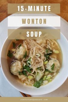 a bowl of wonton soup with noodles and vegetables in it on a white plate