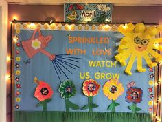 a bulletin board decorated with flowers and the words sprinkled with love watch us grow