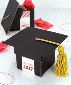 a graduation cap and tassel sitting on top of a table