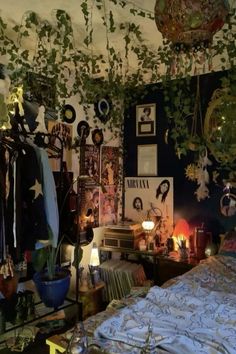 a bed room with a neatly made bed and lots of plants hanging from the ceiling