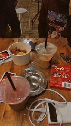 the table is cluttered with food and other items for making desserts on it