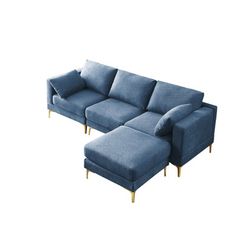 a blue sectional sofa with gold legs and footrests on an isolated white background