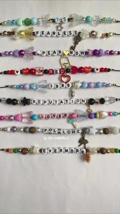 a bunch of bracelets with charms on them