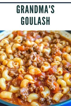 a close up of a bowl of pasta with ground beef and tomato sauce on the side