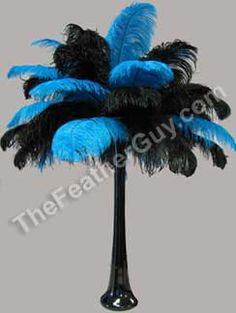 a tall black and blue palm tree with feathers