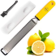 two lemons and a grater on a white background