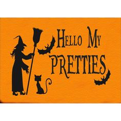 an orange door mat with a silhouette of a witch holding a broom and a cat