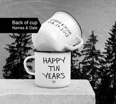 a coffee cup with the words happy tin years written on it sitting on a ledge