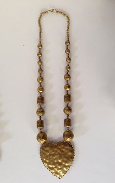 "Your choice of these brass necklaces made in India. Old store stock, vintage \"new\". Heart is 17''in length, The heart is 3.5'' x 3''. The rest are 15'' in length. Chose between Leaf, Star, Paisley or Heart. All have oxidation due to age, but could be polished to a brilliant shine." Paisley Heart, Necklace Leaf, New Heart, Metal Heart, Brass Necklace, Leaf Necklace, Jewelry Pouch, White Metal, Multi Strand