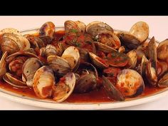 steamed clams in tomato sauce on a plate