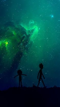 two people are walking in front of the night sky with green and blue stars above them