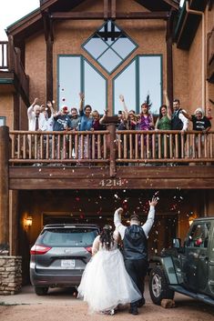 the bride and groom are throwing confetti at each other