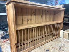 a wooden shelf sitting on top of a hard wood floor