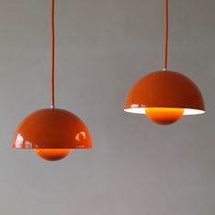 two orange lights hanging from the ceiling