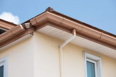 the roof of a house with two windows