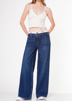 These contemporary wide baggy jeans feature a double waistband and belt loops in a super dark wash for a modern, stylish look. This piece promises to become a staple in your wardrobe. Model is 5'10" wearing size 26. Approx. Front rise: 10.5" Inseam: 31.5"Approx. Knee: 24.25" Leg opening: 25" 100% CottonMade in USA Fits true to size. Super Dark, Baggy Shorts, Jumpsuit Jacket, Kick Flares, Baggy Jeans, Denim Top, Men's Collection, New Product, Top Styles