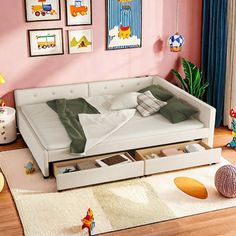 a child's bedroom with pink walls and pictures on the wall