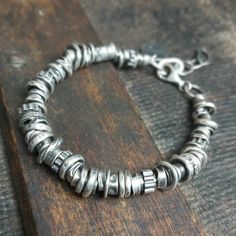 "Handmade unisex oxidized sterling silver bracelet with beads (6-10 mm). It is available with either raw or polished finish - the photo shows a polished bracelet. We offer bracelets in many sizes: 6\" (15 cm), 6.5\" (16,5 cm), 7\" (18cm), 7.5\" (19 cm), 8\" (20,5 cm) 8.5\" (21.5 cm), 9\" (22.5 cm).  Choose the one that is most similar for your wrist circumference and share your actual wrist circumference in the note to your order. This way we can perfectly adjust the size of your bracelet. We send jewelry in an elegant box. Thanks for visiting Treendystudio!" Modern Sterling Silver Bracelets With Oxidized Finish, Minimalist Oxidized Bracelets For Everyday, Artisan Sterling Silver Bracelet With Oxidized Finish, Silver Fusion Bracelets Hand Wrapped, Silver Hand Wrapped Fusion Bracelets, Hand Wrapped Sterling Silver Bracelet, Fusion Style Silver Hand Wrapped Bracelets, Everyday Hand Wrapped Silver Bracelets, Everyday Minimalist Oxidized Bracelets