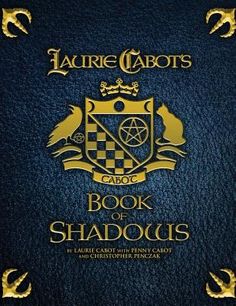 the book of shadows by laurie talbots is shown in gold and blue with an emblem on