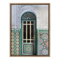 an ornate doorway with green and white tiles on the outside, framed in wooden frame