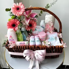 An adorable and a cute gift hamper featuring Johnson's Baby products along with beautiful pink gerberas in a basket. This becomes a perfect gift for newborn baby, brought to you by UAE Flowers Newborn Baby Basket, Newborn Baby Gift Basket, Baby Shower Hamper, Newborn Gift Basket, Baby Bouquet, Hamper Gift Basket, Newborn Baby Girl Gifts