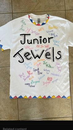 a white t - shirt with the words junior sewells written in different languages