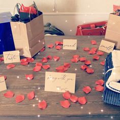 the table is covered with paper flowers and cards