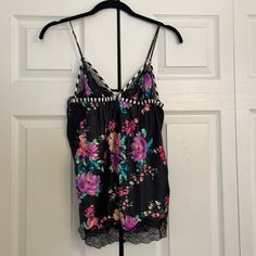 Size Medium Victoria’s Secret Sexy Silky With Lace Trim. Flower Print. Never Worn Black Tops For Pajama Party In Spring, Black Camisole Sleepwear For Spring, Floral Print Camisole Sleepwear, Victoria's Secret Floral Print Sleepwear For Pajama Party, Sleeveless Floral Print Sleep Top, Sleeveless Floral Print Top For Sleep, Flower Night, Night Tops, Flower Print