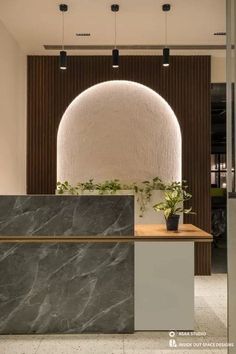 an office lobby with a marble counter top