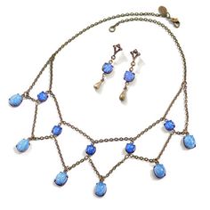 This Delicate But Substantial Vintage Jewelry Set Comes With A Necklace And Pair Of Earrings, On Burnished Bronze Finish. Beautiful Vintage Blue Fire Glass Has A Milky Blue Tone That Works With So Many Things. Perfect Dressed Down With Jeans And Your Favorite Top, Or Dress It Up For A Night Out! Firm$ Gift Boxed Quality Piece 16-18" Adjustable Length 4ne Blue Dangle Necklaces For Formal Occasions, Blue Teardrop Necklace With Matching Earrings, Elegant Adjustable Blue Jewelry Sets, Star Sapphire Necklace, Taurus Pendant, Ivory Pearl Necklace, Jewelry Wishlist, Cotton Necklace, Red Heart Earrings